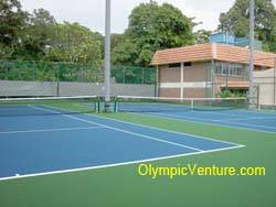 Another view of 2 rubberized cushion tennis courts at Royal Lake Club, KL