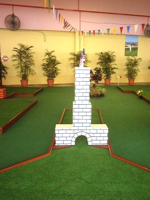 miniature golf hole 7 with tower and malaysian flag decoration